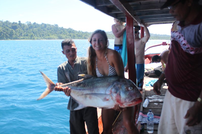 Guests with a fresh catch at the villas