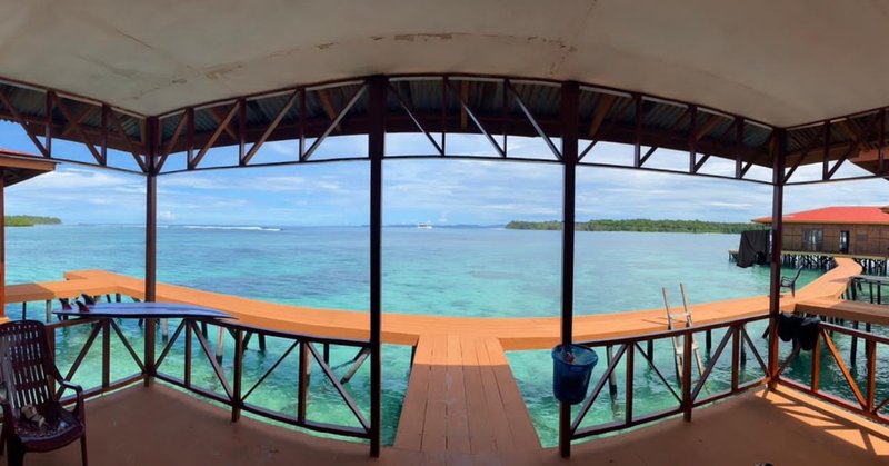 The view over the bay from a covered villa patio