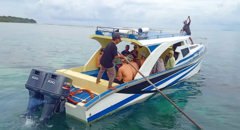 Guests aboard the larger boat, ready to head beyond the bay